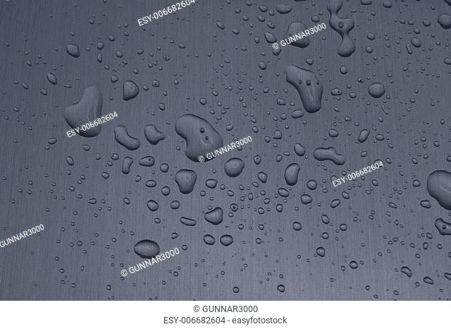 water drops on heavy metal surface texture