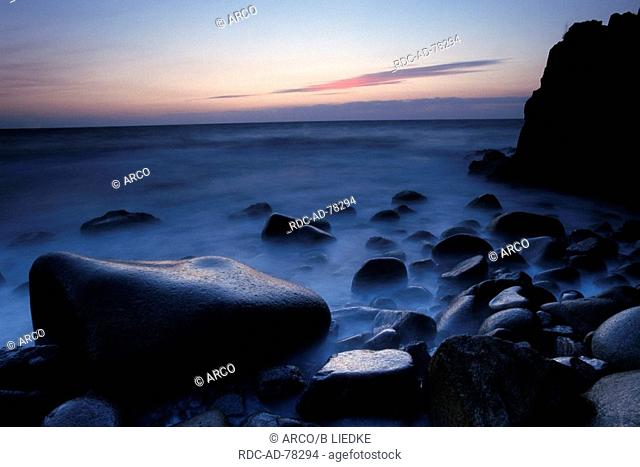 Rocky coast at dusk Jons Kapel Bornholm Denmark