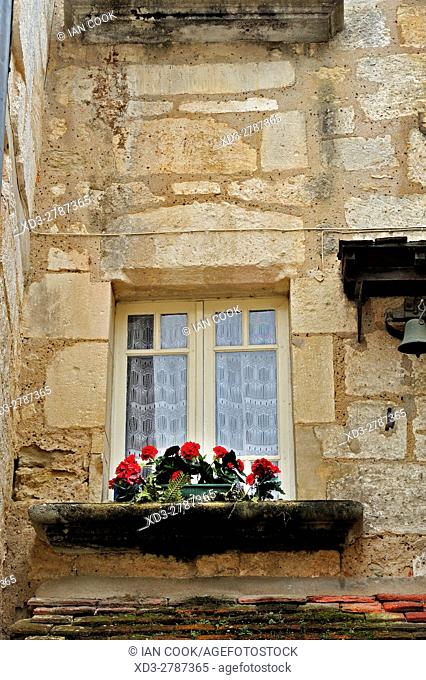 window sill with flowers, Bourdeilles, Dordogne Department, Aquitaine, France