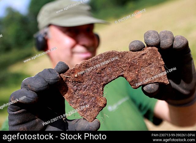 13 July 2023, Saxony-Anhalt, Wernigerode: An axe from the time of the Peasants' War is one of the numerous finds discovered by volunteers during archaeological...