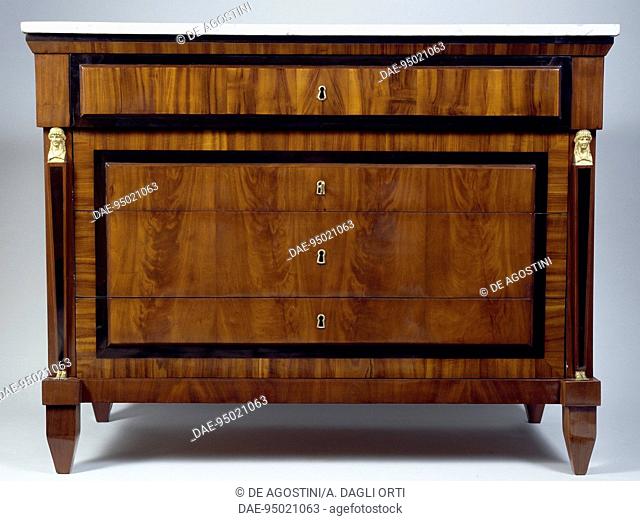 Empire style chest of drawers with mahogany veneer finish and ebony frame. Russia, 19th century.  Private Collection