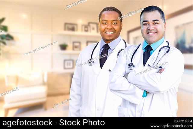 African american and hispanic doctors or nurses standing in office