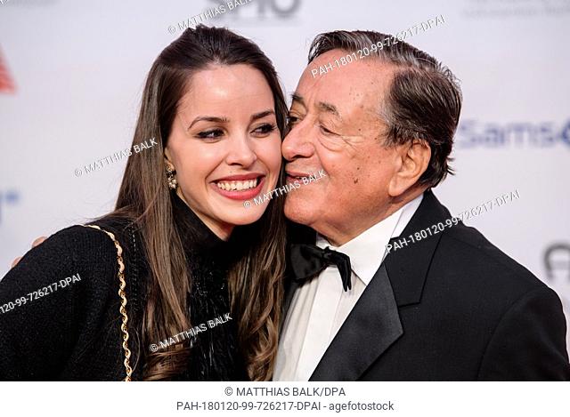 Business man Richard Lugner kissing his girlfriend Jasmin on the red carpet ahead of the 45th German Film Ball in the Bayerischer Hof in Munich, Germany