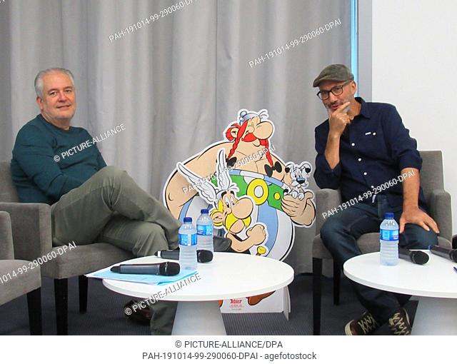 13 December 2019, France (France), Vanves: Didier Conrad (l), illustrator of the Asterix and Obelix figures, and Jean-Yves Ferri, copywriter