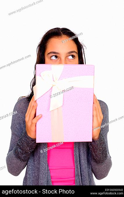 Studio shot of young beautiful teenage girl isolated against white background