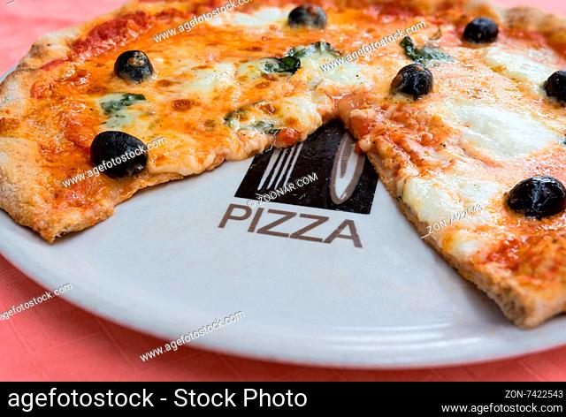 Pictured wheat pizza with olives tomato basil and mozzarella Neapolitan (bufala)