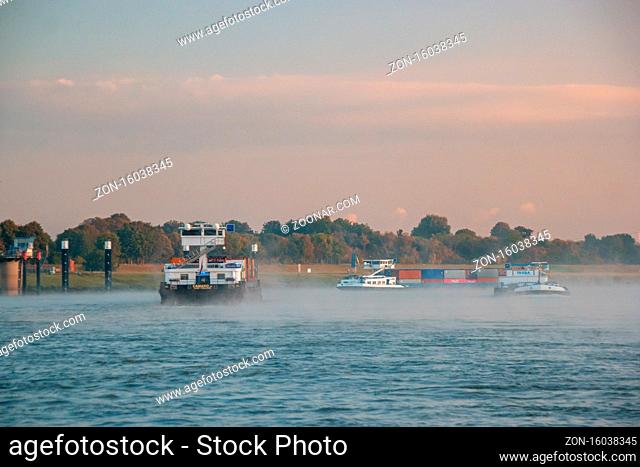 Cologne Germany August 2020, Inland shipping transport on the rhine river with containers, Large container and oiltanker vessel on the river rhein in Germany...