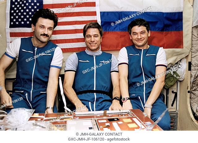 Posed in the Base Block of Russia's Mir Space Station is the Mir-22 crew, now composed of, left to right, Aleksandr Y. Kaleri, John E