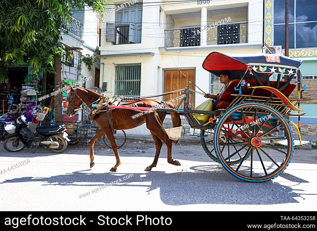 MYANMAR, YANGON - OCTOBER 28, 2023: A horse-drawn cart by Nyaung U Market. Yuri Smityuk/TASS