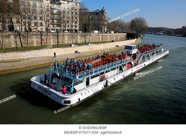 Tourist boat on the Seine river in Paris