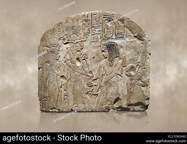 Ancient Egyptian stele depicting Sethy I adoring Amenhotep I and Nefertari, limestone, New Kingdom, 19th Dynasty, (1279-1213 BC), Deir el-Medina