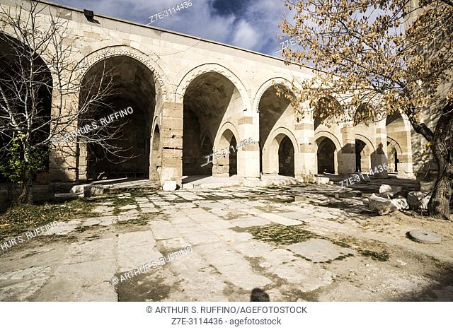 Courtyard colonnade with open chambers. Caravanserai of Agzikarahan, 13th century caravan inn for merchants, Cappadocia, Turkey