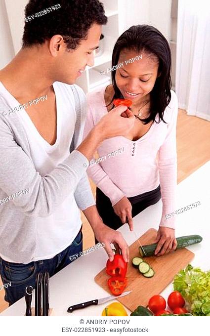 Couple Chopping Vegetables