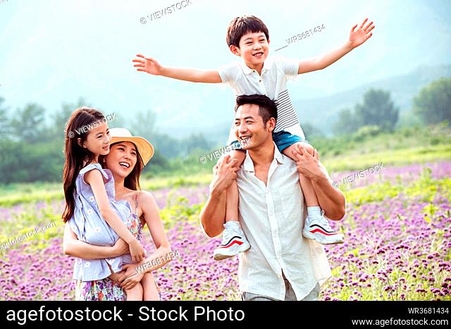 Play in the flower sea happy family of four