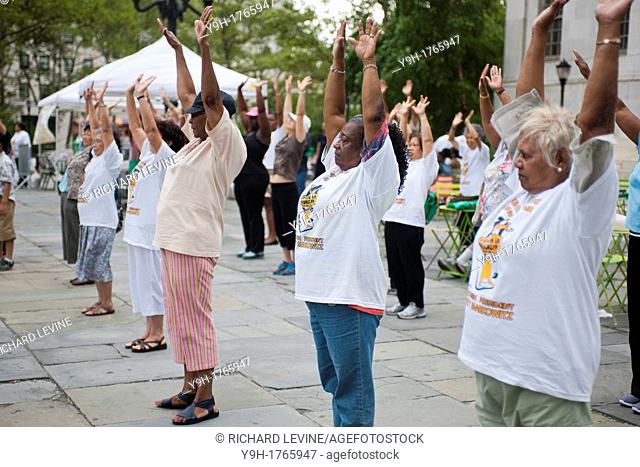 Senior citizens participate in a restorative movement class taught by a member of the Mark Morris Dance Company at Borough Hall in Brooklyn in New York during...