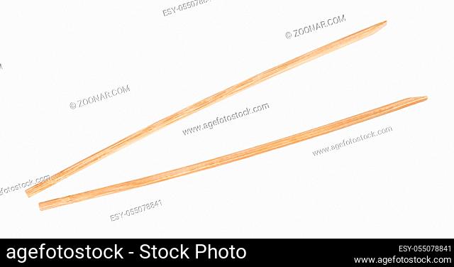 disposable brown wooden chopsticks isolated on white background