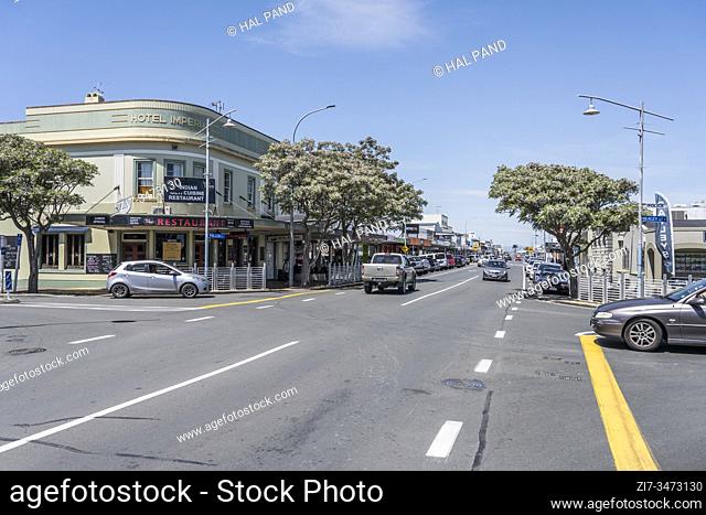 THAMES, NEW ZEALAND - November 07 2019: cityscape of historical village with road crossing on main street, shot in bright late spring light on november 07 2019...