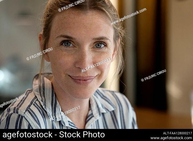Portrait of smiling mature woman in office