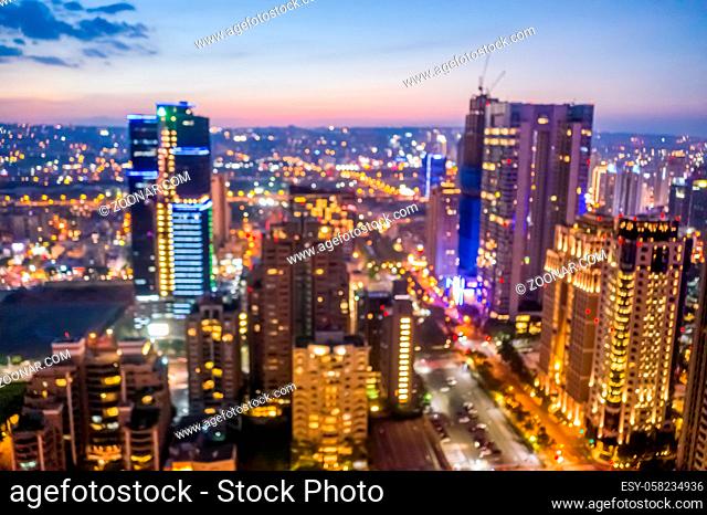 abstract background of city skyline at night in aerial view, shallow depth of focus