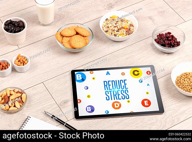 Healthy Tablet Pc compostion with REDUCE STRESS inscription, weight loss concept
