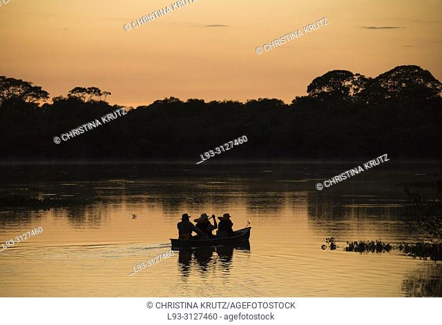 Boat at sunrise on the Rio Claro, Pantanal, Brazil