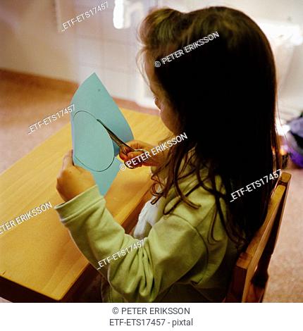 Girl cutting paper