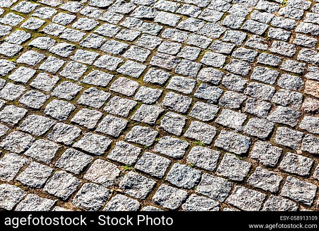 Abstract background of cobblestones making from rough stone blocks