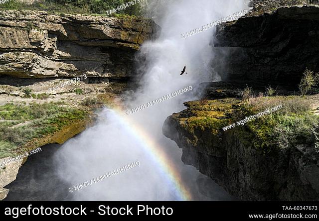 RUSSIA, REPUBLIC OF DAGESTAN - JULY 8, 2023: A rainbow forms over a waterfall near the Gunib Hydroelectric Power Plant. Nikolai Mikhalchenko/TASS