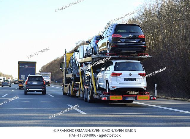 Truck transports cars, car transport, road, car transporter, car, overpass, new car, Volkswagen, VW. Car traffic, road traffic, goods traffic