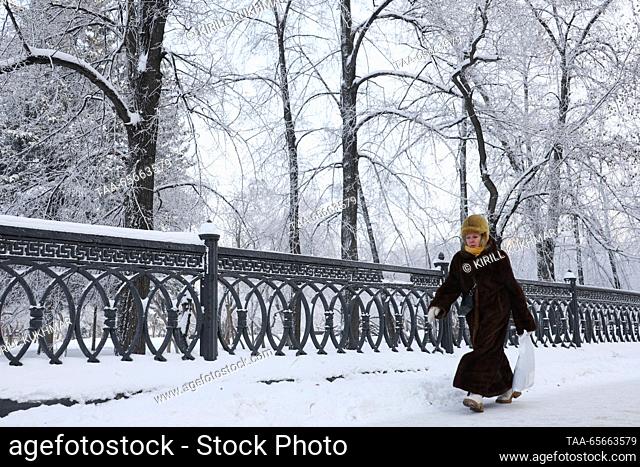 RUSSIA, NOVOSIBIRSK - DECEMBER 12, 2023: A woman is seen in a park in Central District during severe frost in winter. On 11 December