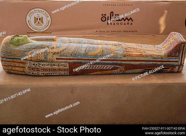 27 May 2023, Egypt, Saqqara: A sarcophagus can be seen during the announcement of the discovery of two human and animal embalming workshops