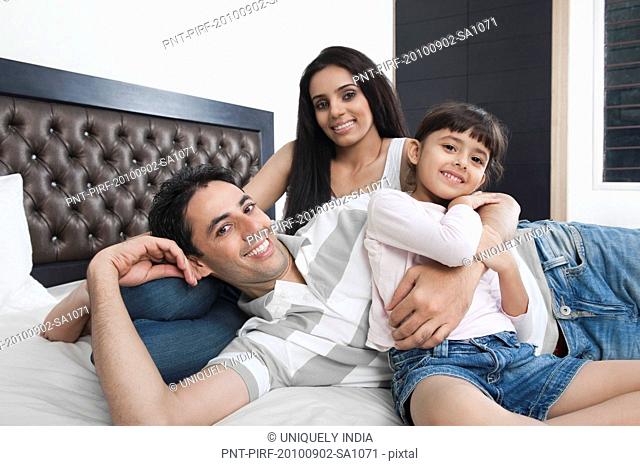 Family enjoying in a bedroom