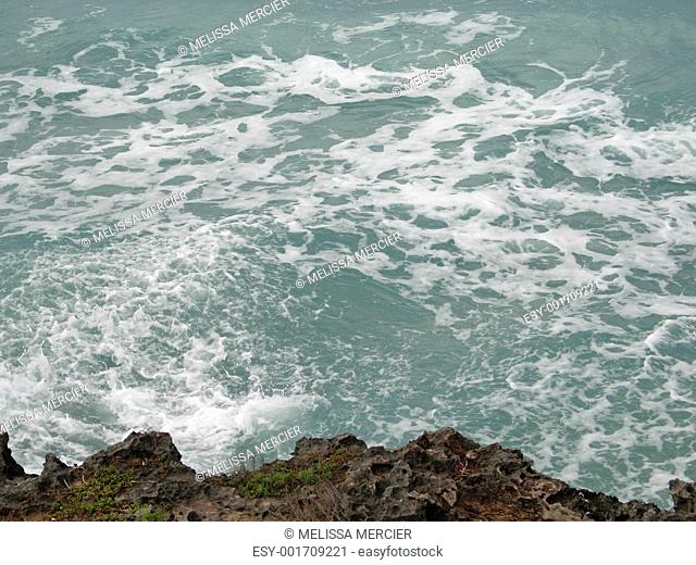 wave crashing on a cliff