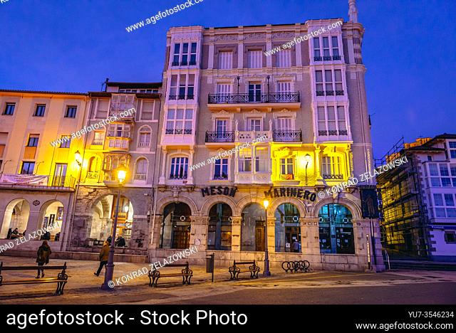 Historic building with Meson El Marinero restaurant on Plaza Ayuntamiento - Town Hall square in Castro Urdiales seaport in Cantabria region of Spain