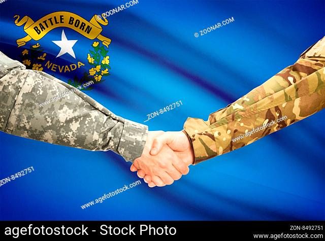 Soldiers handshake and US state flag - Nevada