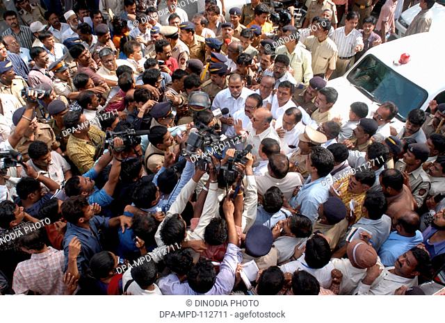 Media thronged to get reactions of chief minister of Maharashtra Sushil Kumar Shinde along with home minister Chhagan Bhujbal and state minister Kripa Shanker...