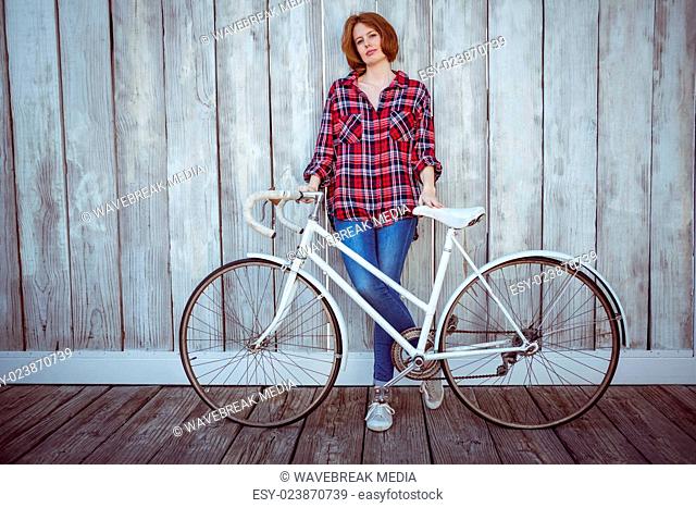 beautiful hipster woman with a bicycle