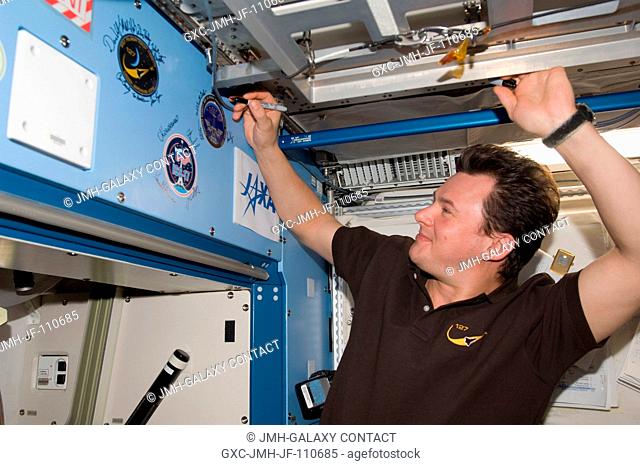 Flight day 11 activities for the joint shuttle-station crews included the traditional autographing of the station. Russian Federal Space Agency cosmonaut Roman...