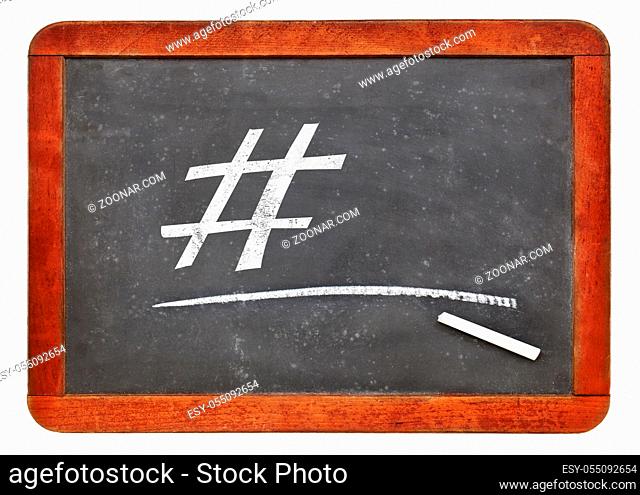 social media concept - hashtag in white chalk on a vintage slate blackboard