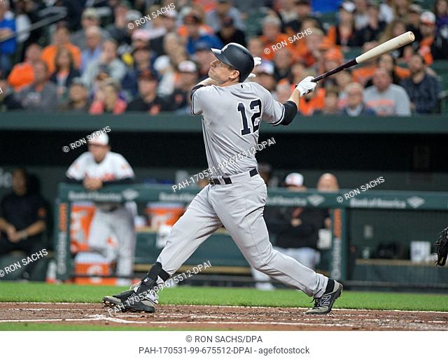 New York Yankees third baseman Chase Headley (12) flies out to center field in the second inning against the Baltimore Orioles at Oriole Park at Camden Yards in...