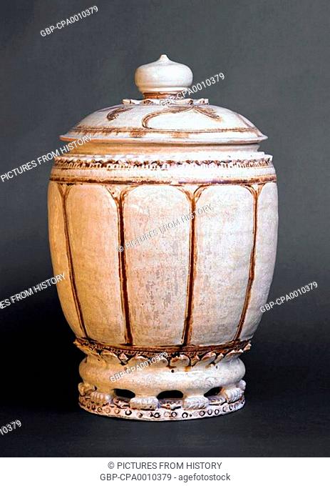 Vietnam: Large Thanh Hoa Jar with Lid. Lobed body with brown highlights, standing on a reticulated pedestal base. Ly Dynasty (c. 1000-1200 CE)