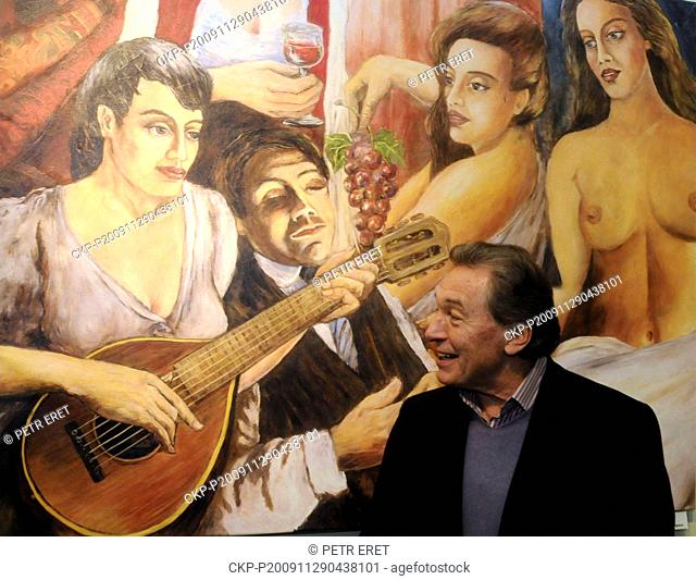 Czech pop star Karel Gott stands in front of his canvas during the opening of an exhibition of his paintings in Stary Plzenec