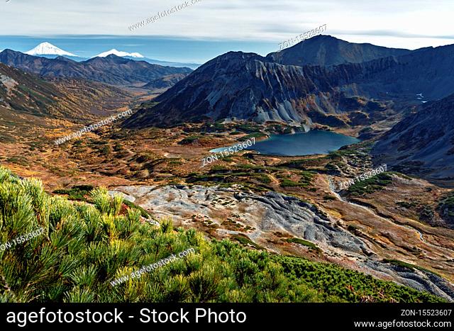 Beautiful autumn mountain landscape: picturesque view of mountains, lake and volcanoes. Far East, Russia, Kamchatka Peninsula