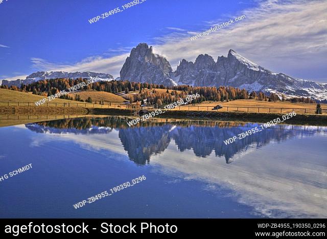 Italy Italian Dolomites Alpe di Siusi Sasso Lungo and Sasso Piatto with reflections in lake Europe European Italia Italian Alto Adige Dolomites Italian Alps...