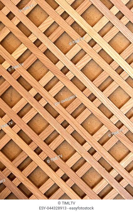 Decorative wooden lattice on a brown background