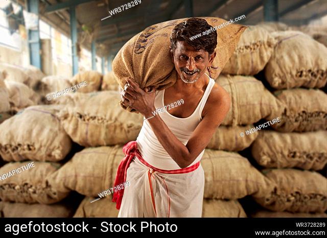 A FARMER CARRYING HIS PRODUCE