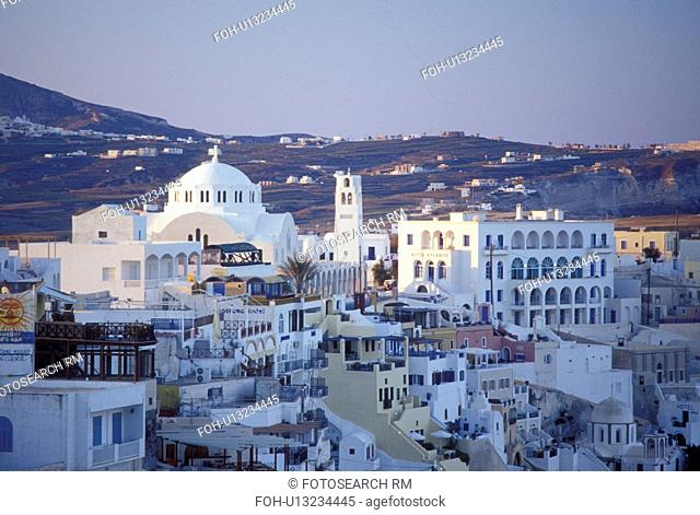 Greece, Santorini, Greek Islands, Fira, Cyclades, Europe, Whitewashed buildings in the village of Fira on the steep hillside of Santorini Island on the Aegean...