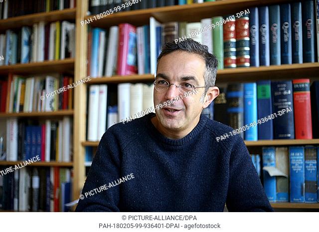 Navid Kermani, writer and orientalist, speaking in his office in Cologne, Germany, 05 February 2018. Photo: Oliver Berg/dpa