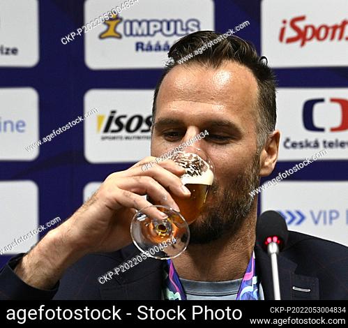 David Krejci, forward of Czech national ice hockey team, drinks beer during the press conference after returning from the 2022 IIHF Ice Hockey World...