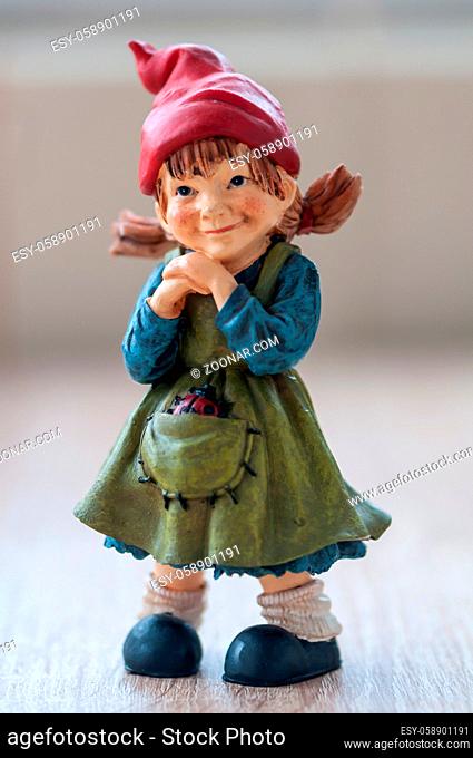 Close-up of a garden gnome on a wooden table
